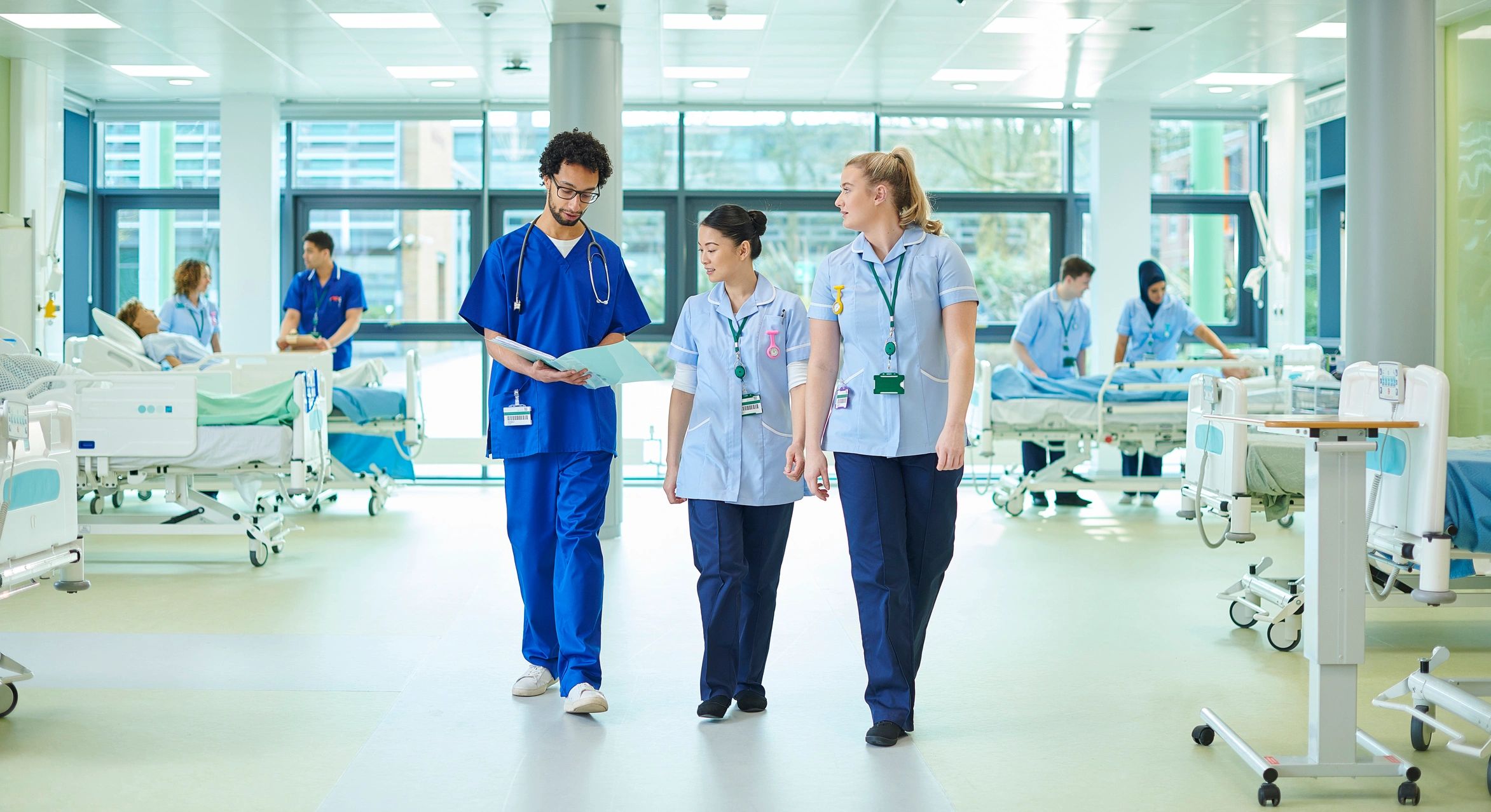 Clinical team supporting care delivery on a hospital ward