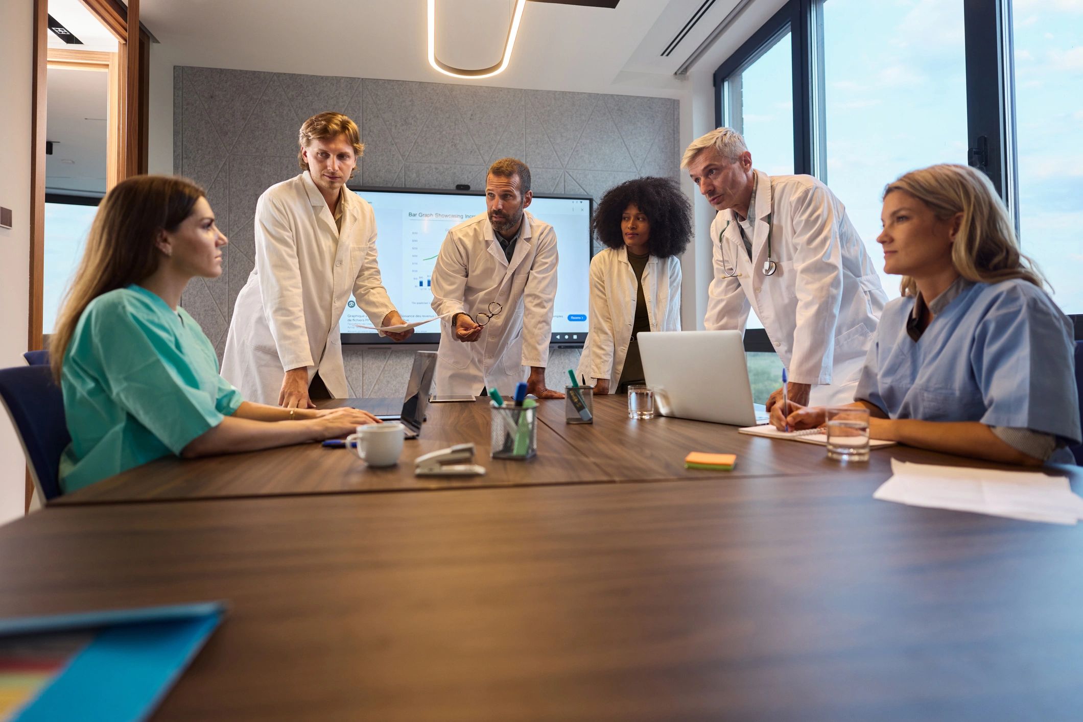 Doctors collaborating in a modern office meeting