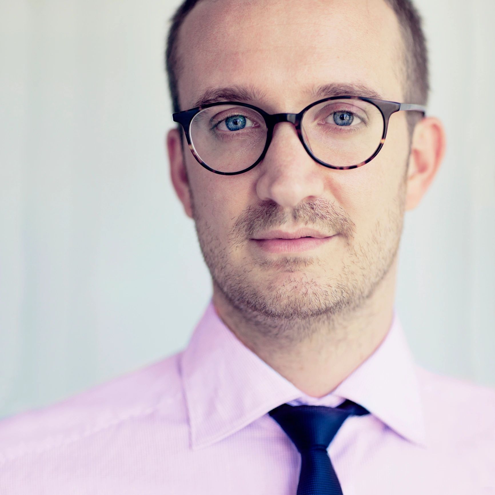 Professional portrait representing finance leadership